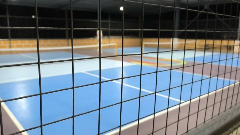 CEH-ABC Gym - pickleball courts, viewed from their basketball court  divided by a screen fence